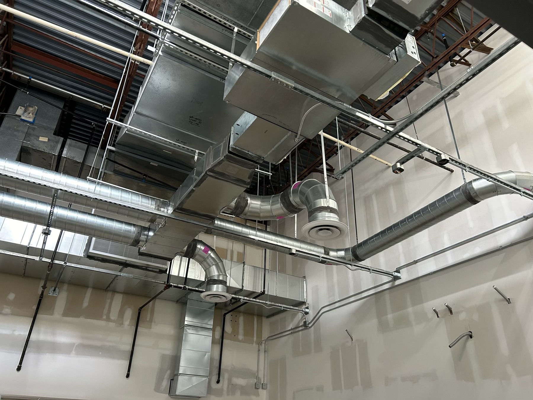Custom sheet metal ductwork installed in a commercial space
