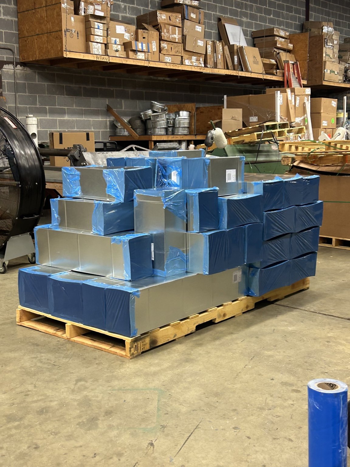 Sheet metal duct sections in the workshop